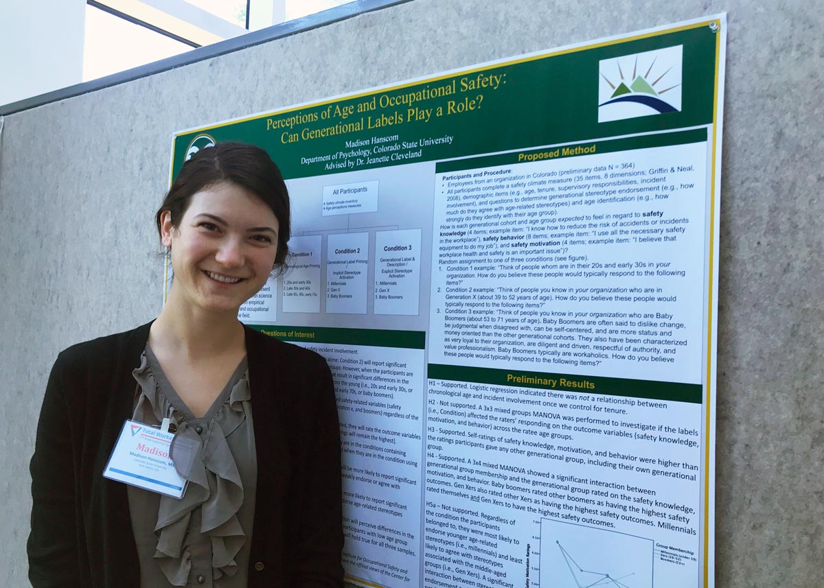 MAP ERC student standing in front of her research poster