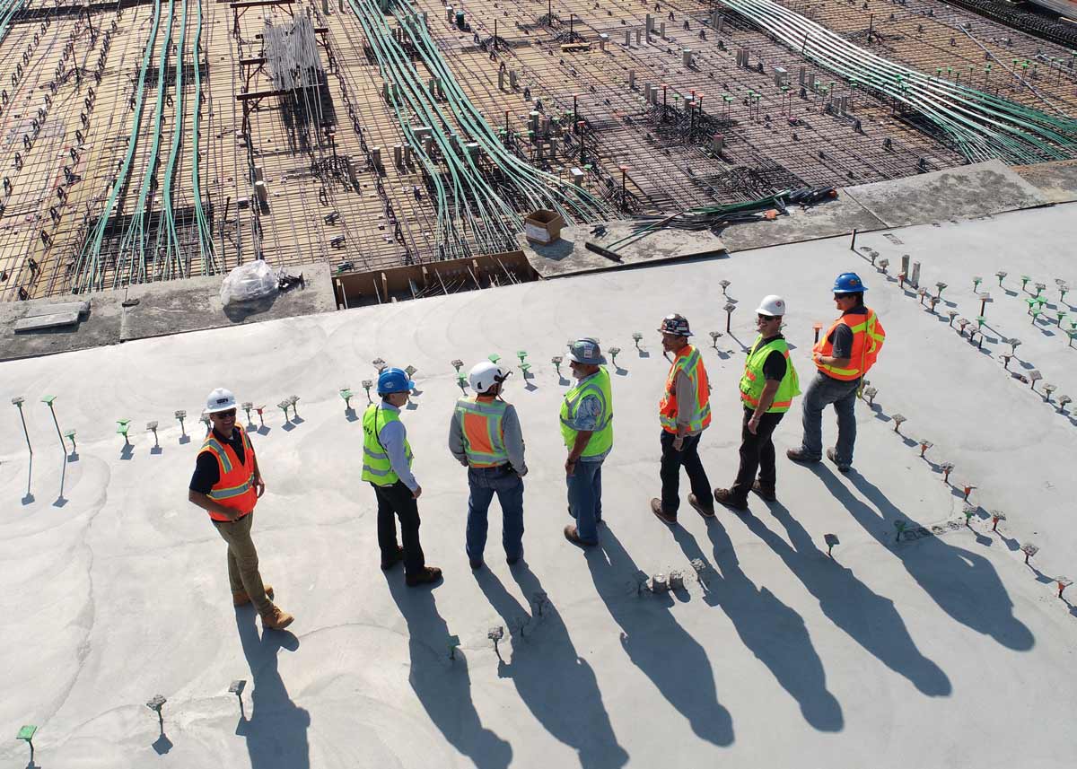 a group of construction workers wearing hard hats