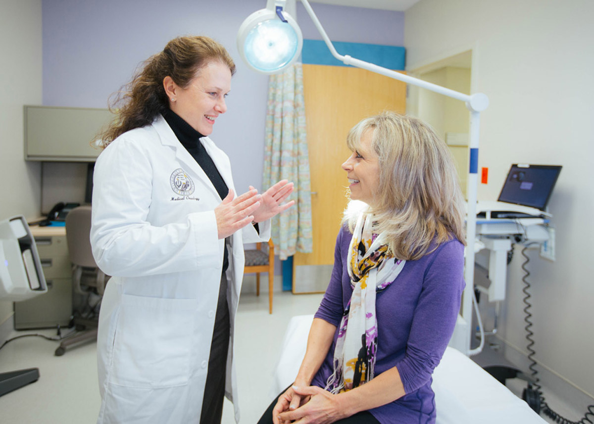 doctor talking with a patient in a clinic room