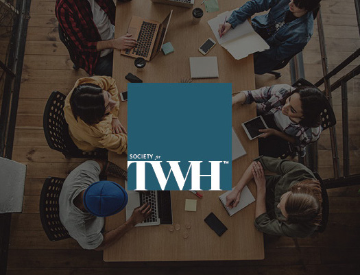 people at a desk, soceity for total worker health logo