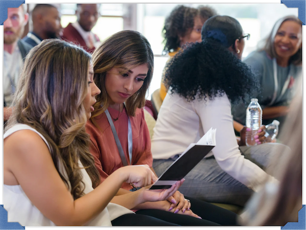 Women talking at conference