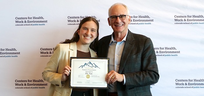 Lee Newman presents Allie Kom with Platform presentation award