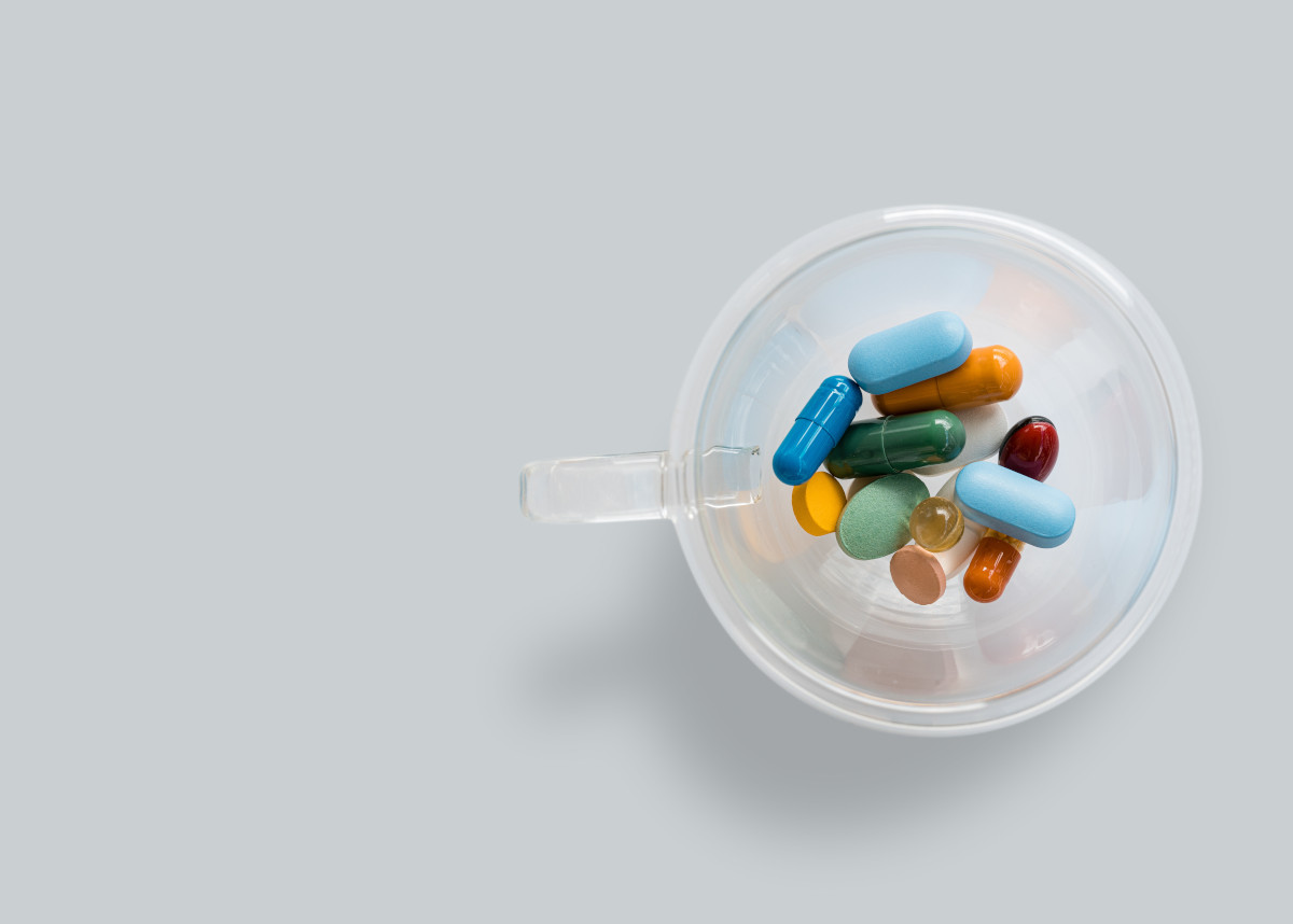 various pills in a clear cup