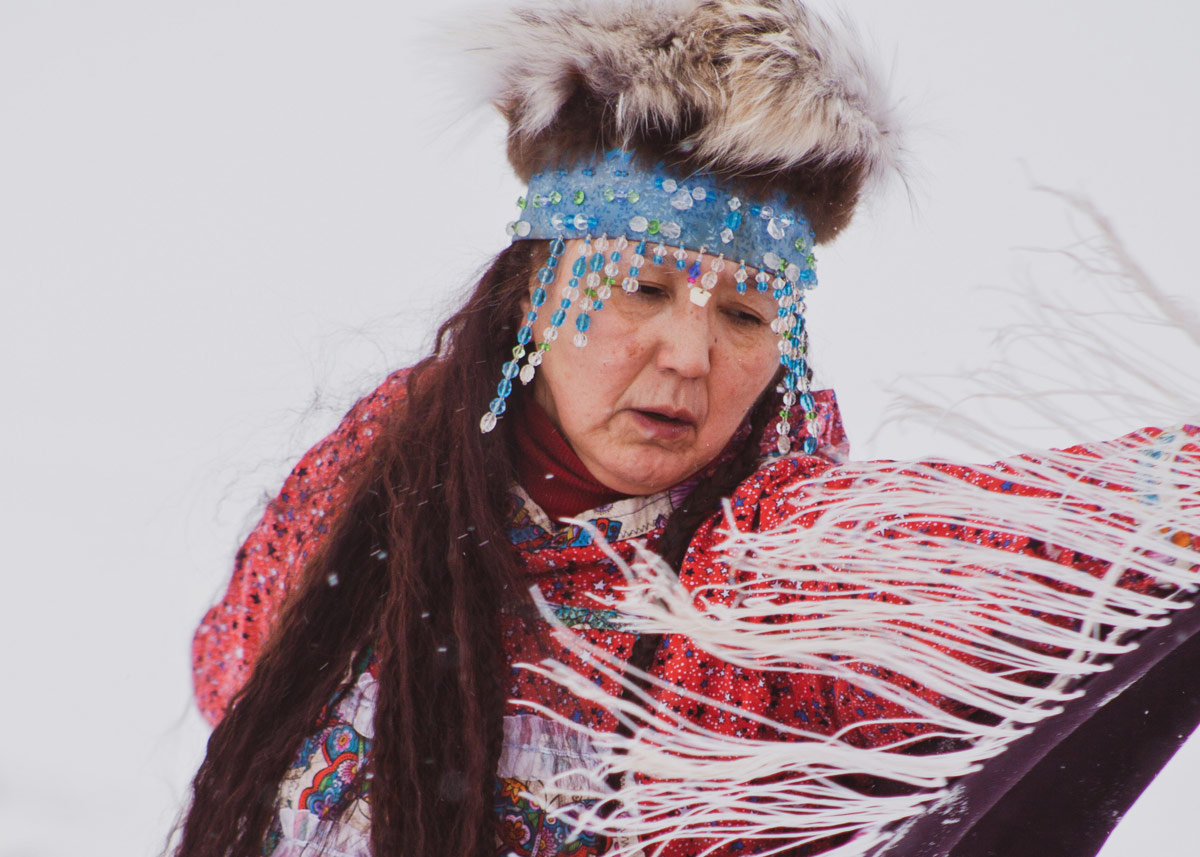 Alaska Native woman dancing in traditional garments