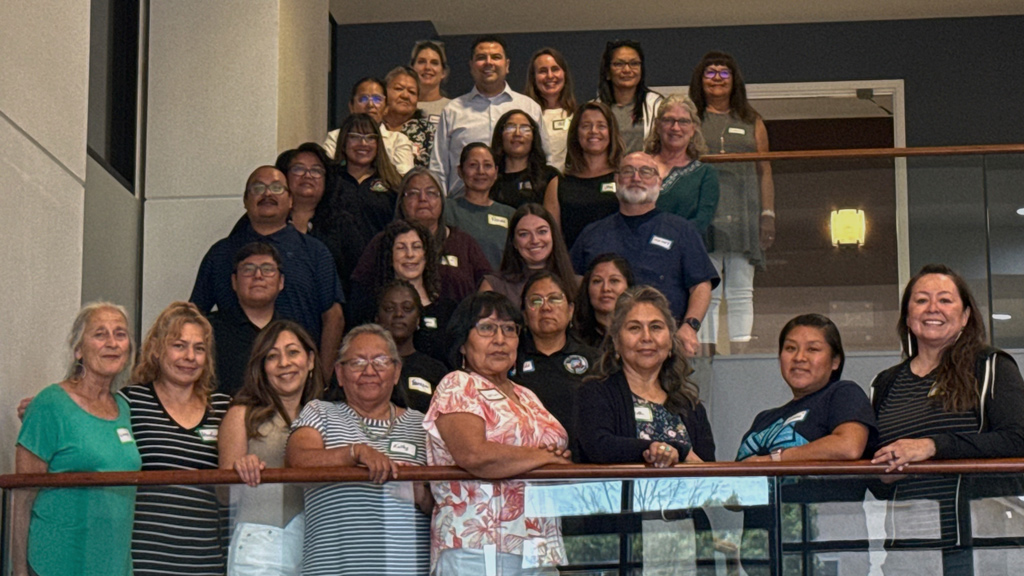 A group of people posed on a staircase