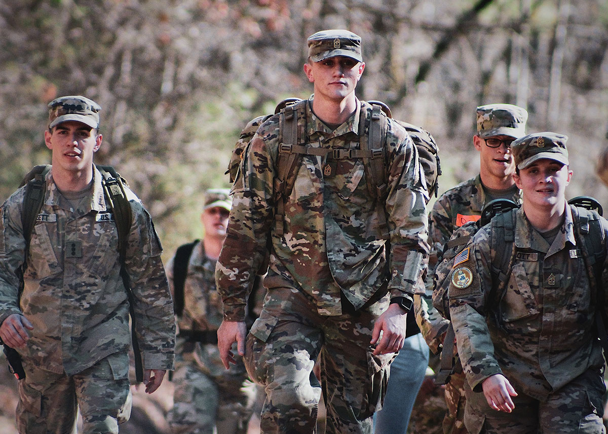 Uniformed US service members walking outdoors