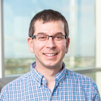 headshot of casey greene