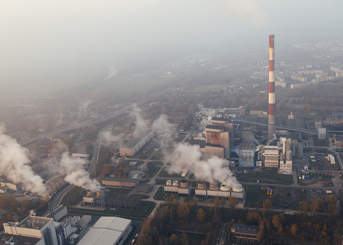 Aerial image of production plant releasing pollution