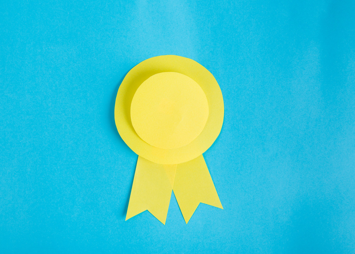 yellow paper ribbon on blue background