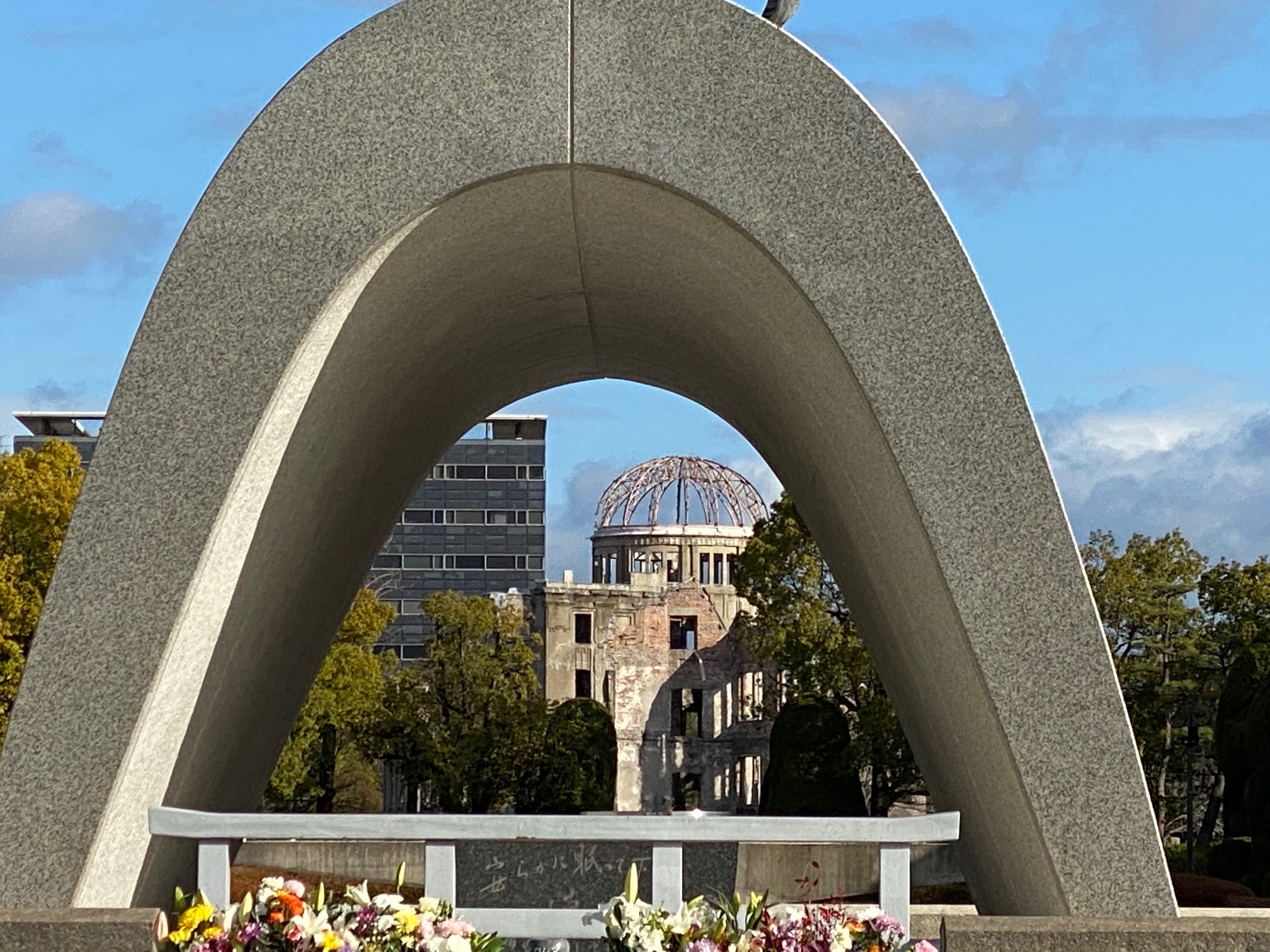 The A-Bomb Dome seen through the Peace Cenotaph at the Hiroshima Peace Park.