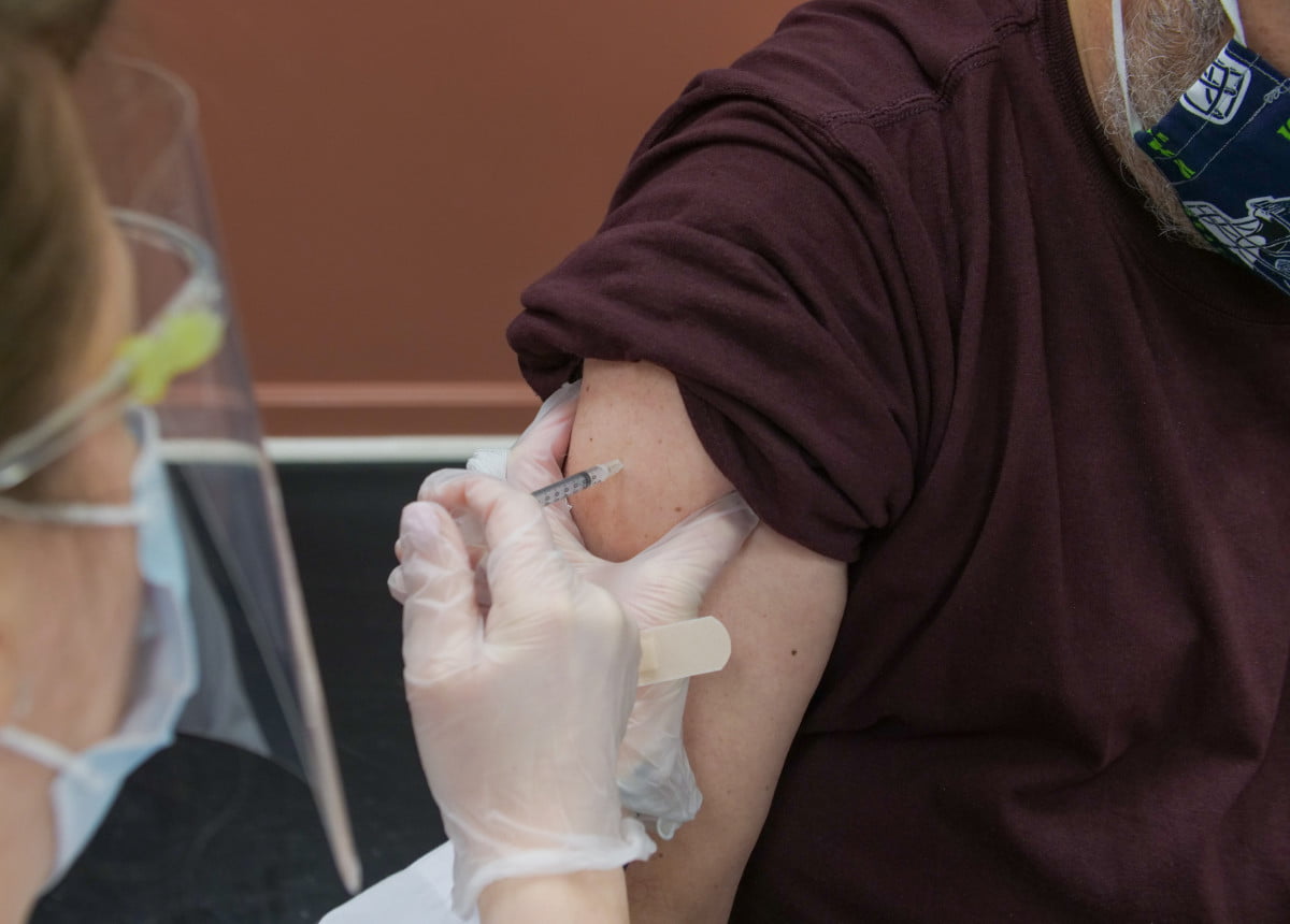 person receiving vaccine in arm
