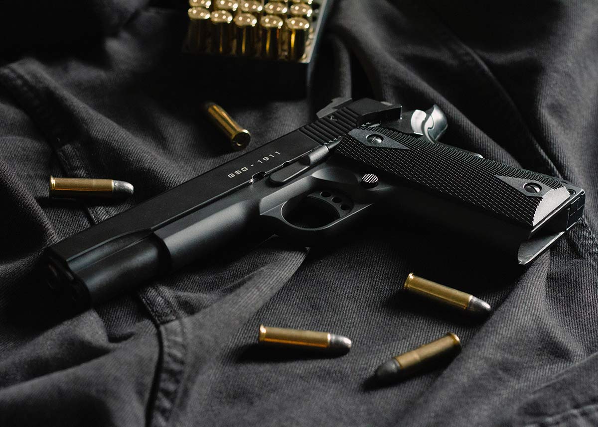 black handgun and ammunition