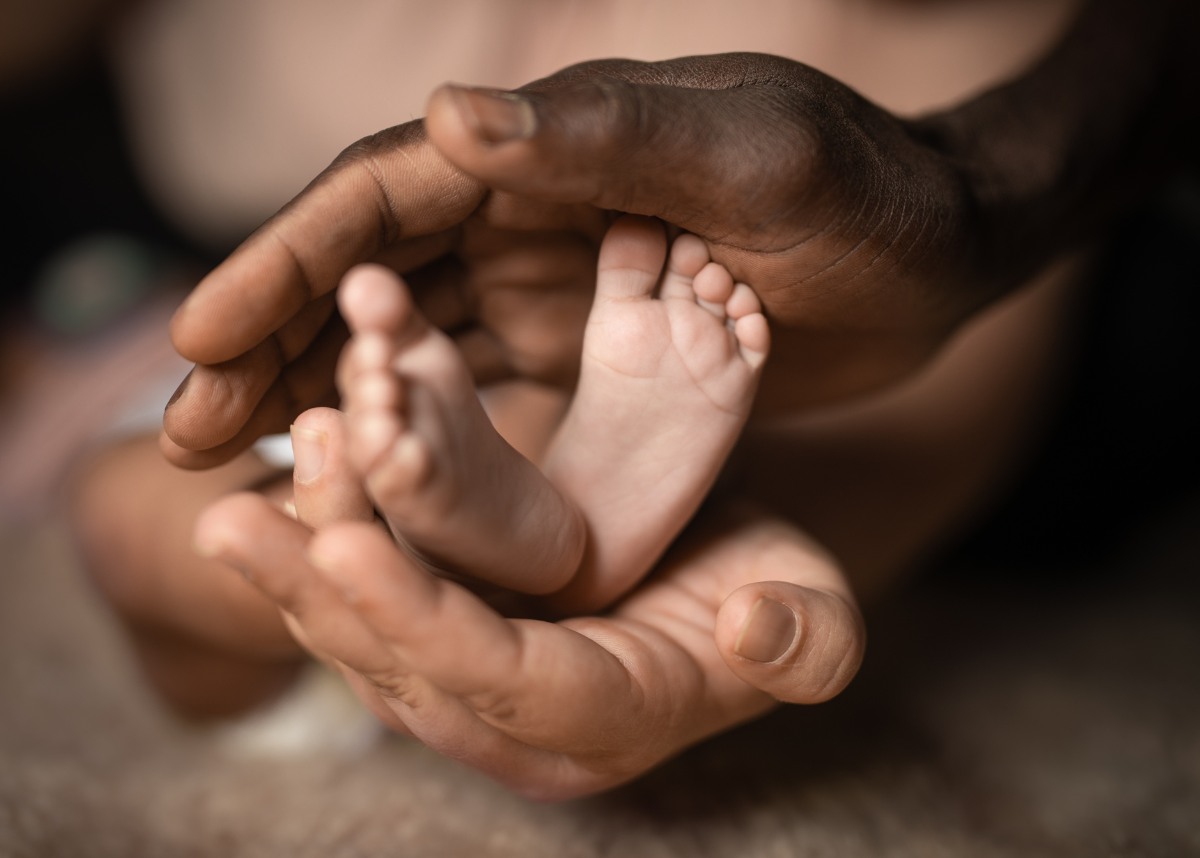 Image of babys feet in hands