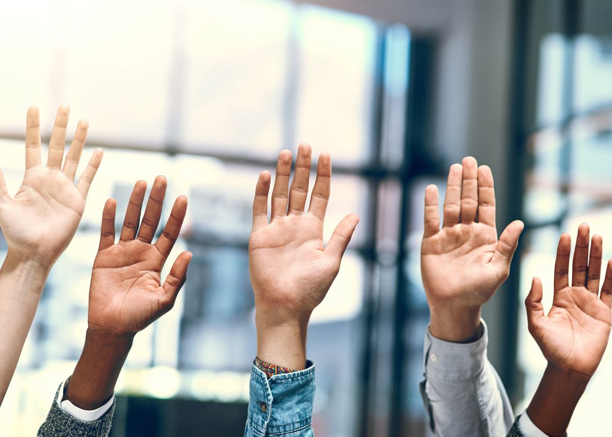 hands being raised in the air