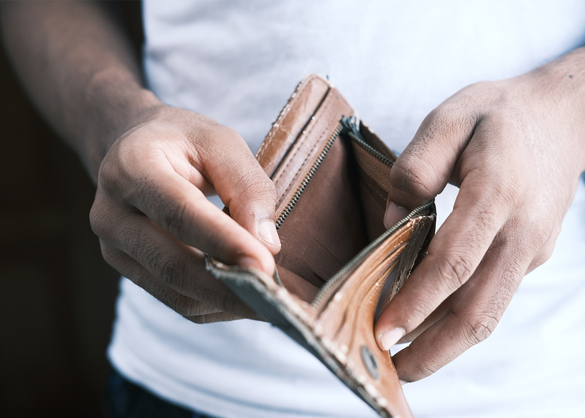 Person holding open an empty wallet