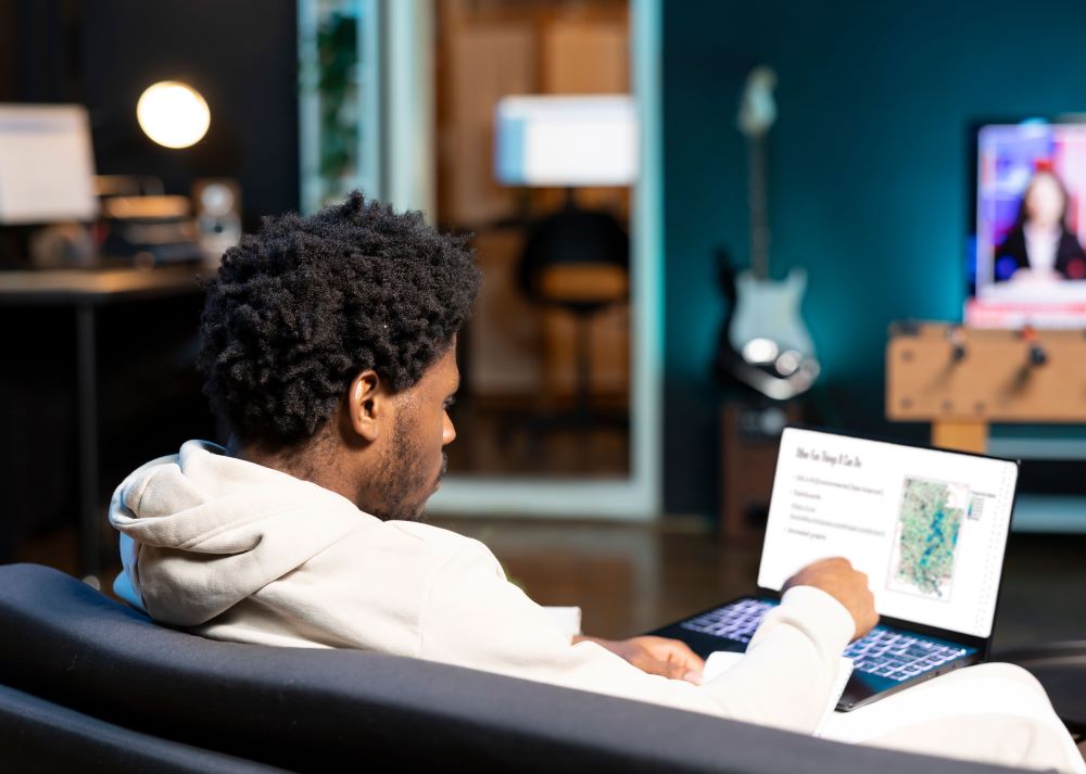 man sitting on laptop