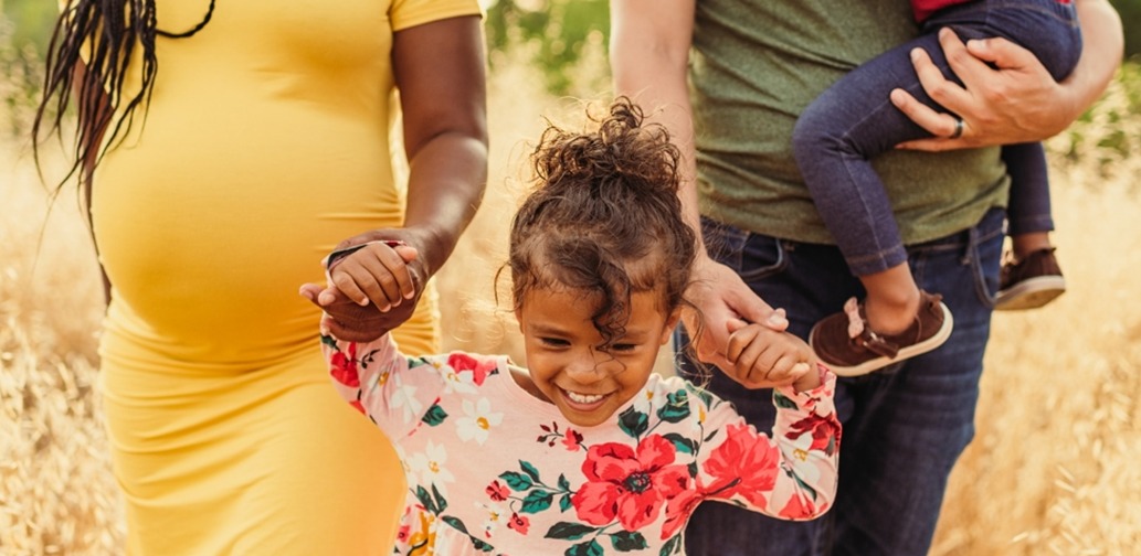 Child holding parent hands