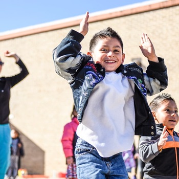 Children doing physical exercise outside