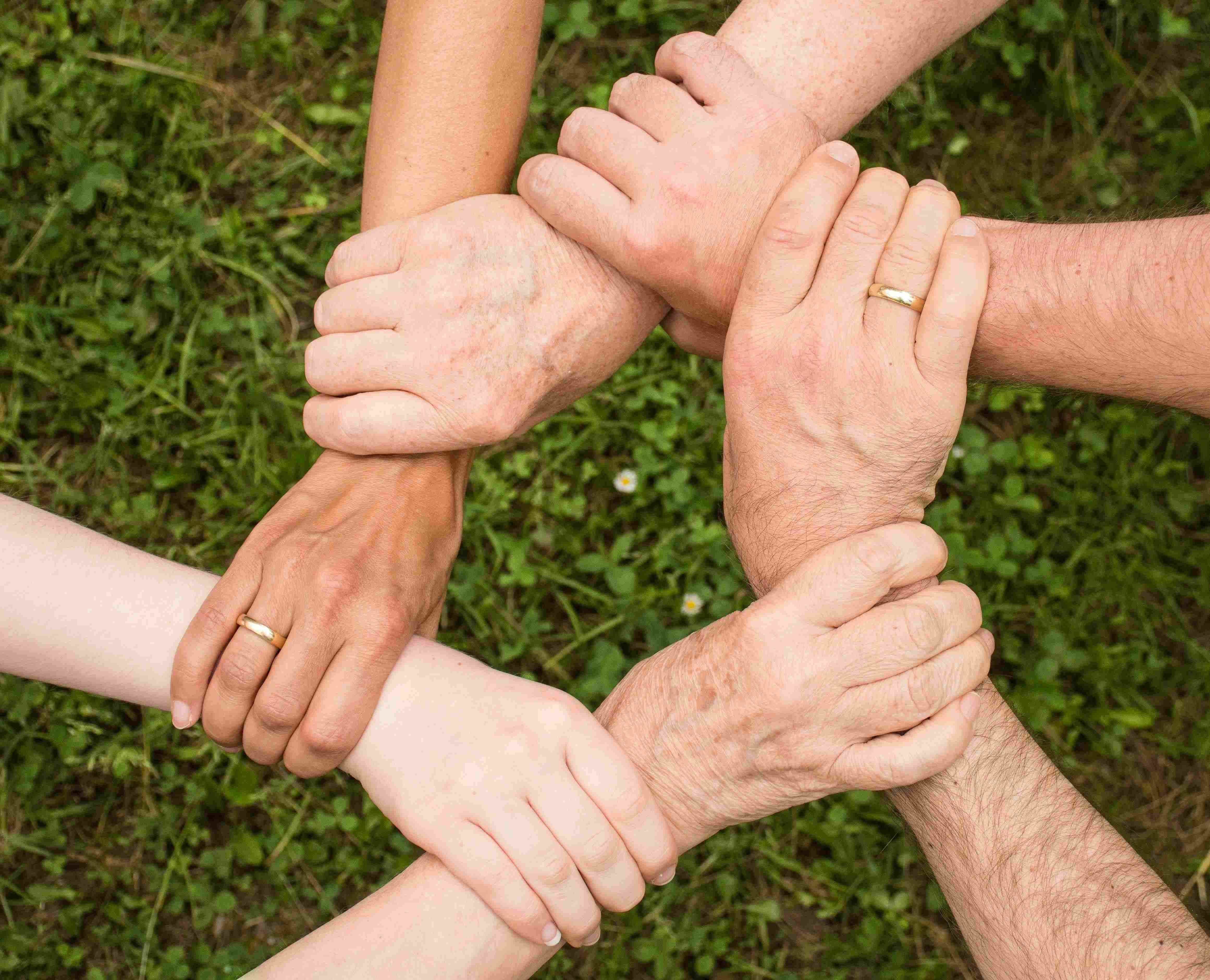 People Linking Hands together